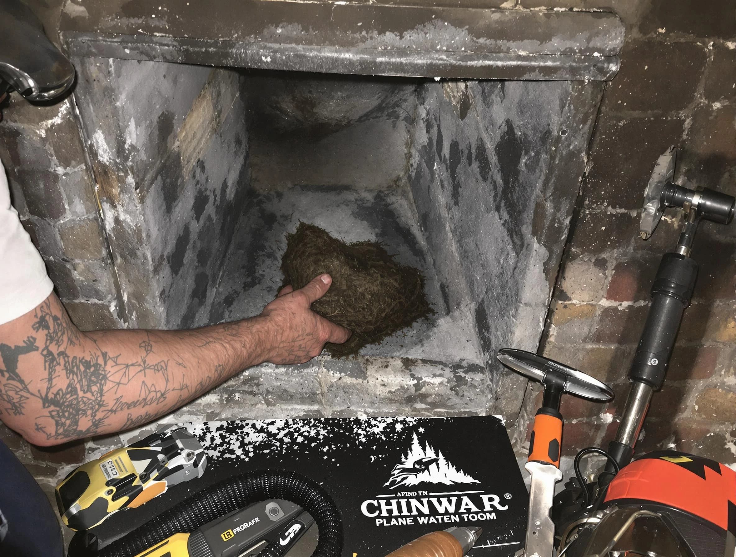 Marlborough Chimney Sweep safely removing debris and screening chimney in Marlborough, MA